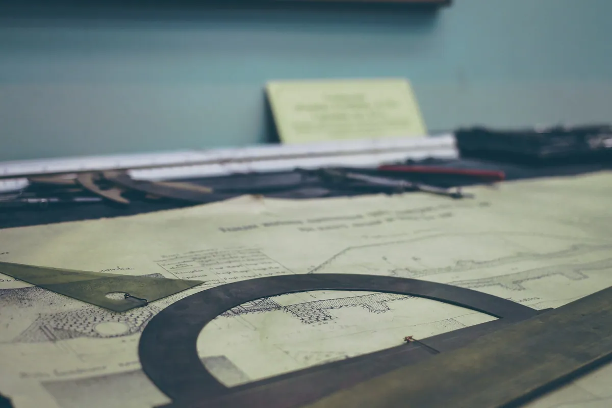 Printed beam design and drafting instruments on a desk