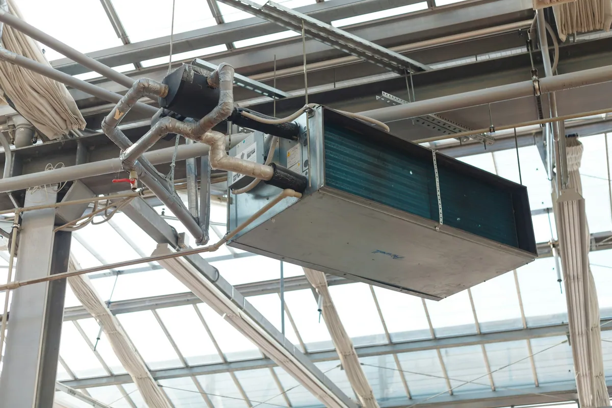 Suspended ventilation equipment and ducts in a building