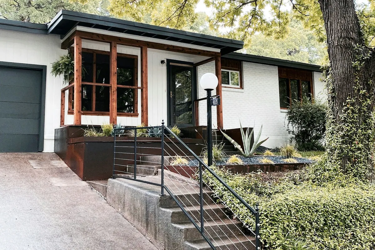 Residential exterior with timber accents and planting